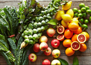a group of fruits and vegetables on a wood surface Healthy Weight Loss Diets Falkirk